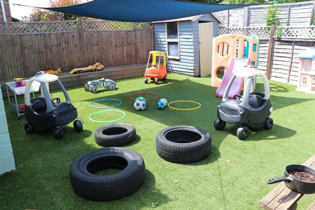 a bright outdoor play area at the house that jack built nursery