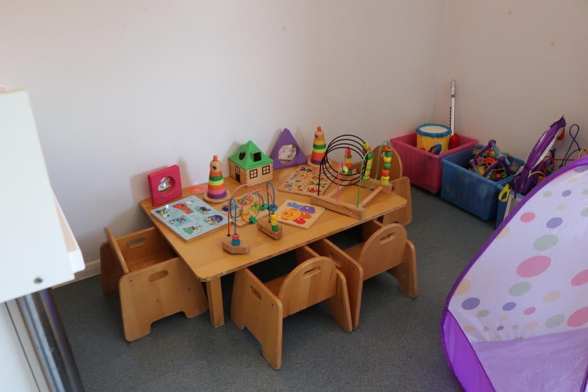 Educational toys and wooden table in The House That Jack Built Flackwell Heath